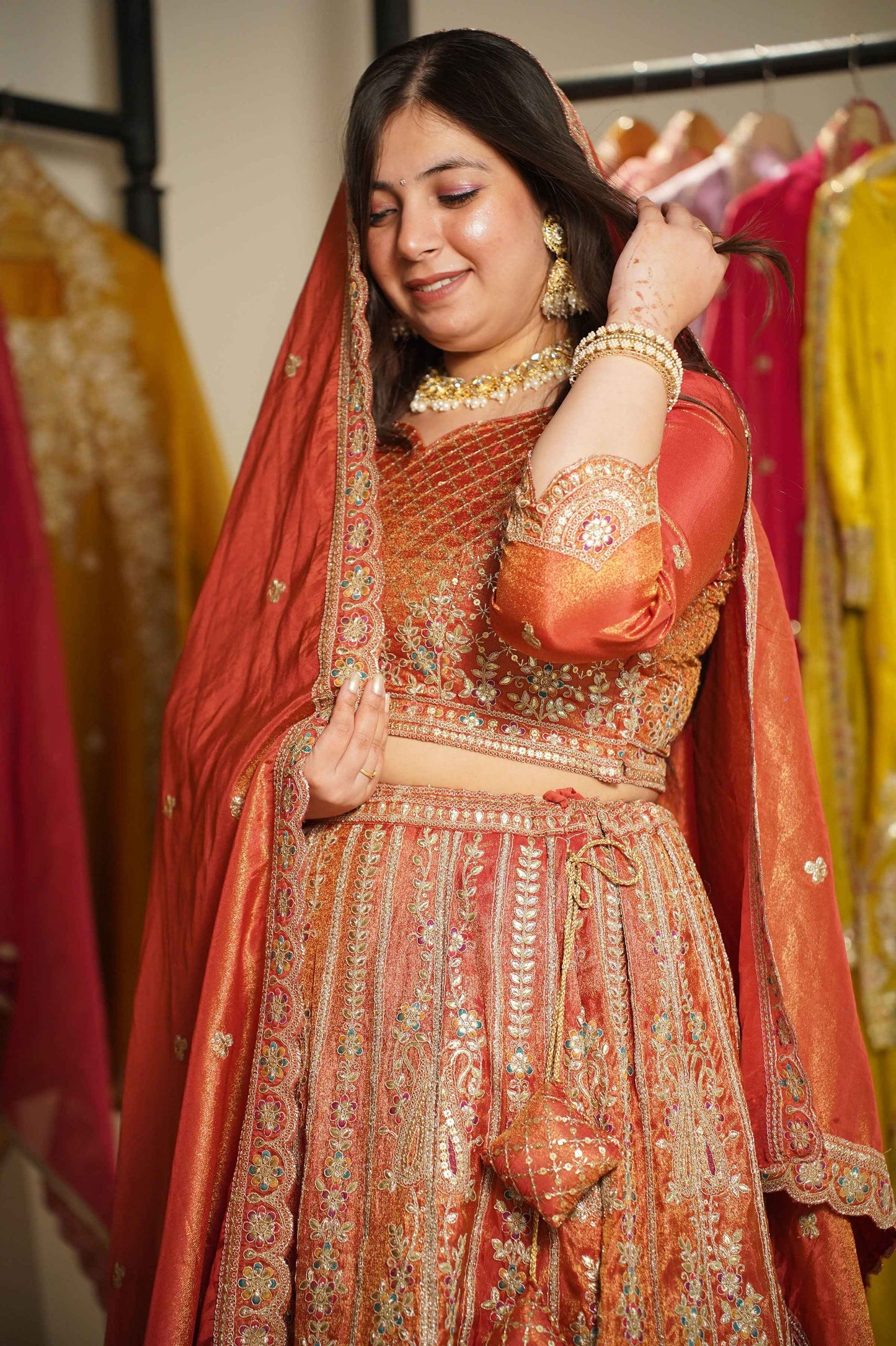 Mehzara Rust Tissue Lehenga With Zari Embroidery