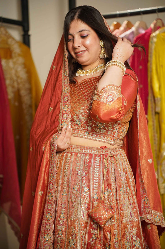 Mehzara Rust Tissue Lehenga With Zari Embroidery